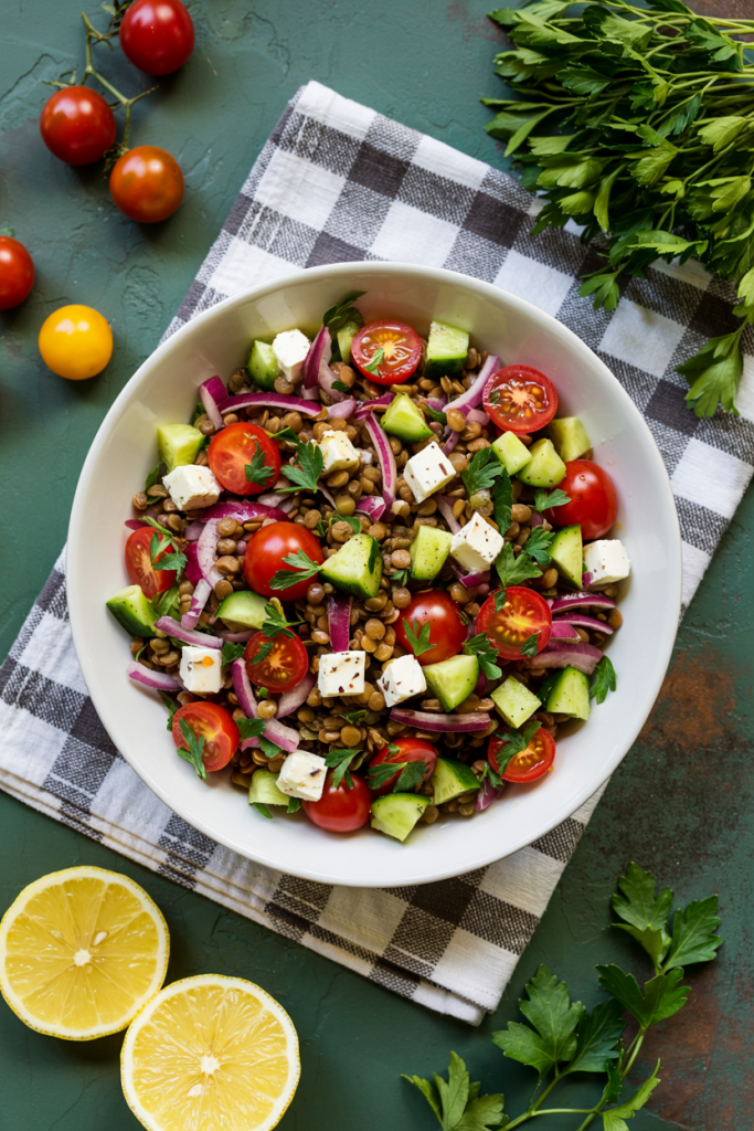 Greek Lentil Salad served in a bowl with fresh vegetables and herbs